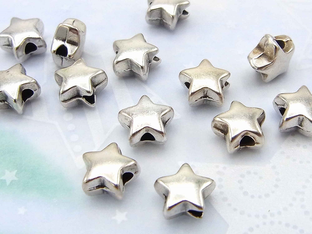 10 x Metallperle, kleine Sterne, 6 mm, versilbert<br />1,90 €