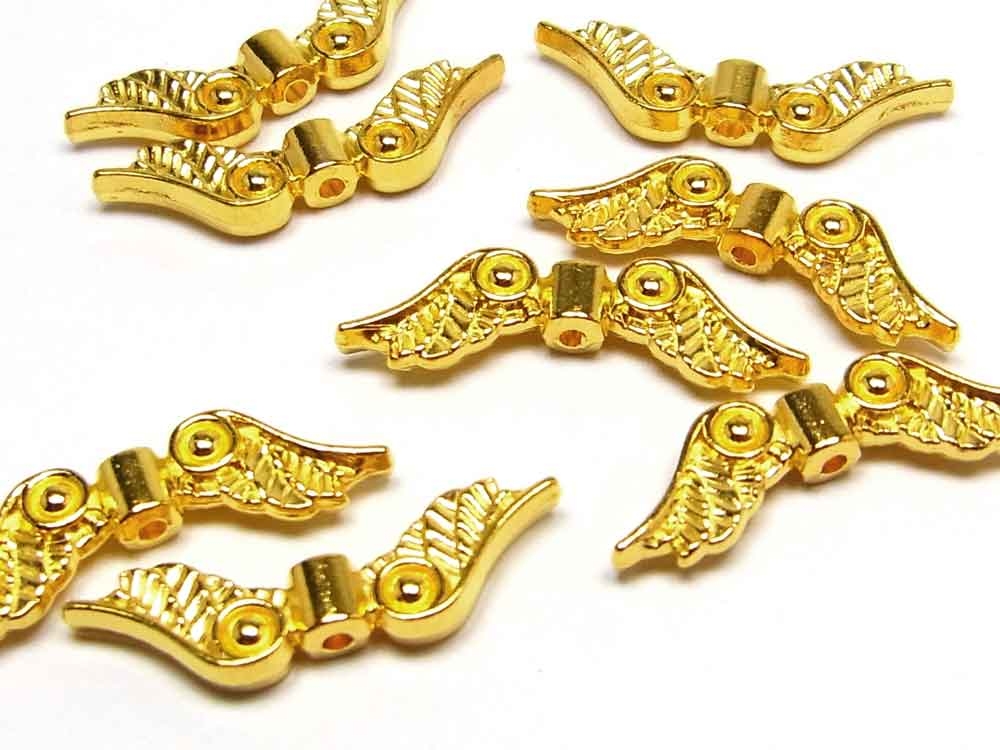 10 x Metallperle, Flügel, 22 x 7 mm, vergoldet<br /><span class=