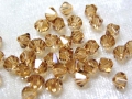 20 x Swarovski Elements, bicone, 4 mm, light colorado topas